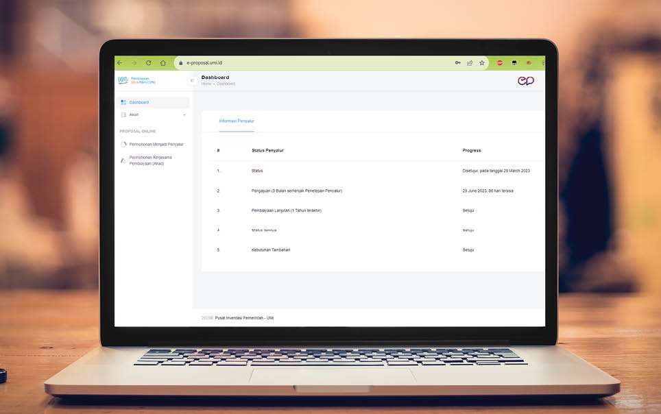 Laptop with blank screen on table.