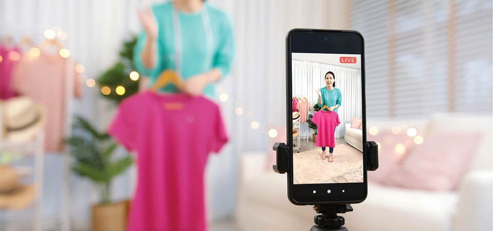 Asia vlogger woman influencer, SME retail store owner smile enjoy selling show live sale online screen in IG story reel tiktok work at home studio. Gen Z people record viral video selfie shoot app.