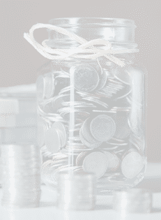 Bottles of cash with coins in saving money concept