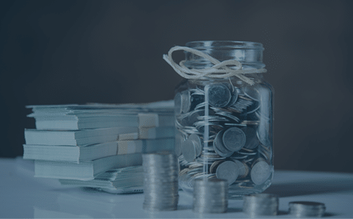 Bottles of cash with coins in saving money concept