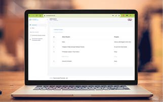 Laptop with blank screen on table.